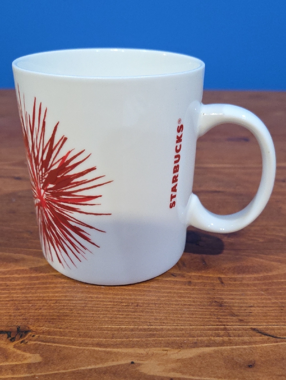 Starbucks White Mug with Red Burst Design